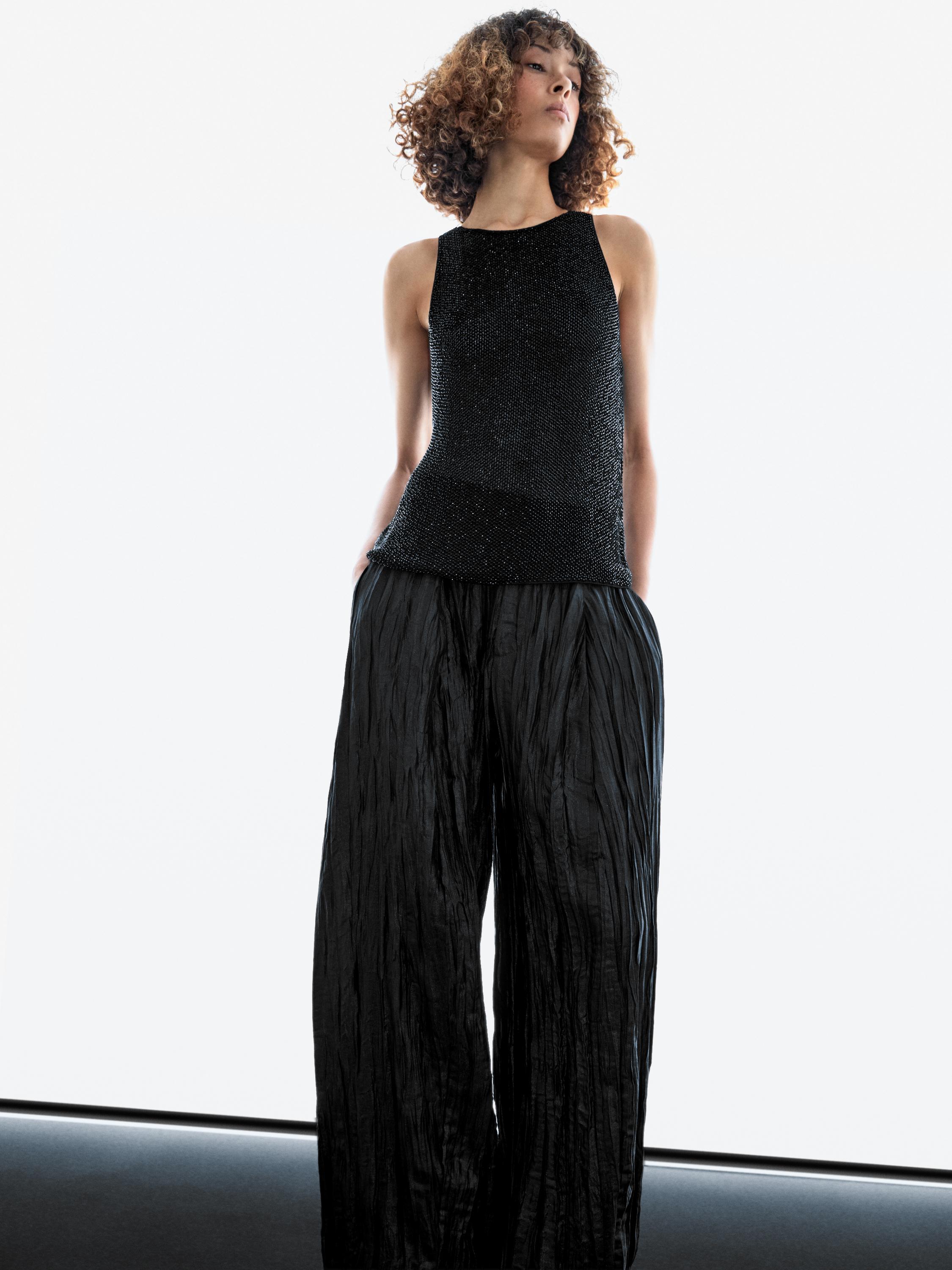 Creased pleated-effect wide-leg trousers